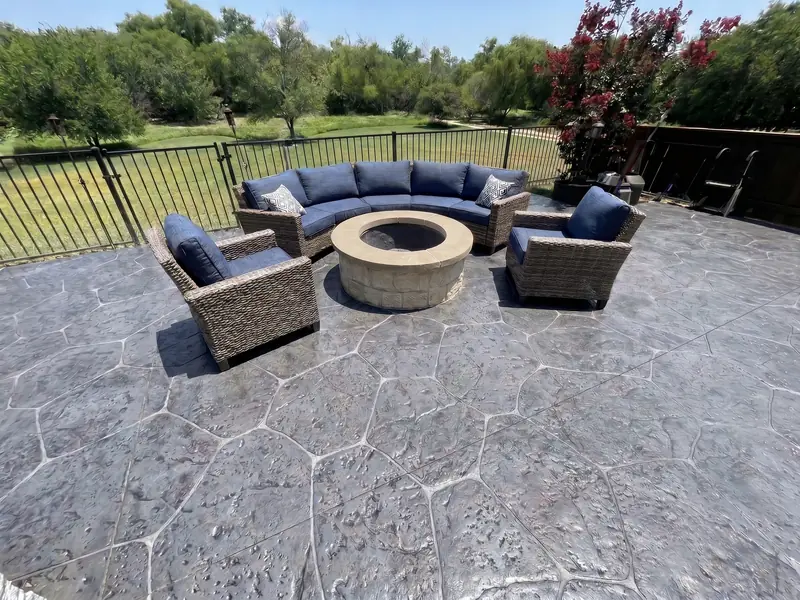 Design example: Stamped concrete patio with a fire pit and outdoor seating