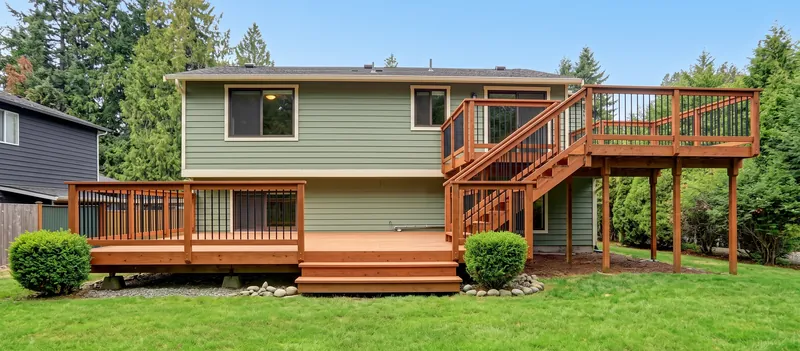 Design example: Two-level stained wood deck with stairs up to an upper landing