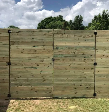 Horizontal wood fence with a double gate